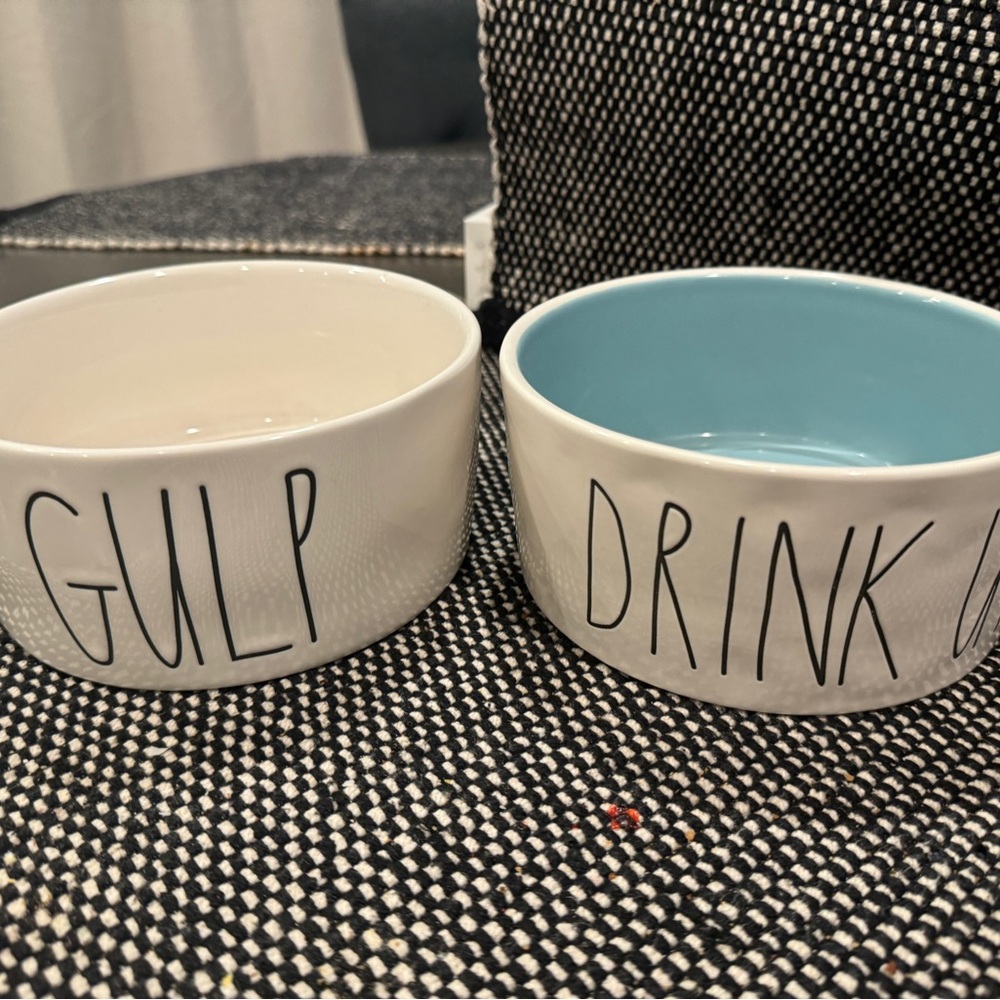 Two Rae Dunn dog bowls